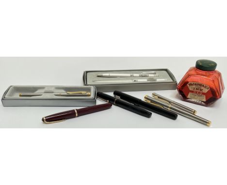 A group of vintage pens comprising an Onoto pen, a Swan pen, three two tone white/yellow metal pens, an additional black pen,