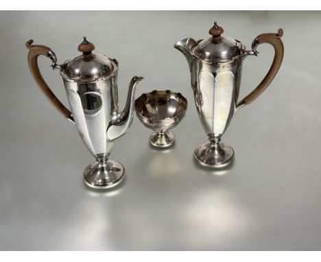 An Edwardian Birmingham silver three piece part tea a coffee set of circular tapered panel design with crenelated border to t