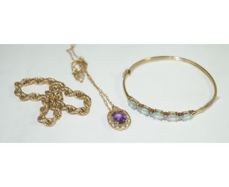 A damaged diamond chip and topaz yellow metal bangle, approx 6.1gms, a 9ct yellow gold rope twist bracelet, approx 3.5gms and