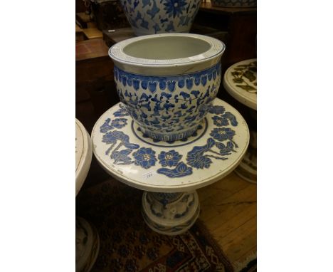 A Chinese blue and white ceramic circular table, the top decorated with flowers with elephant base, Chinese blue and white ce