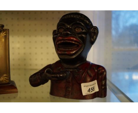 A vintage cast metal money bank.
