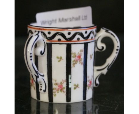 A Coalport ceramic miniature tyg with floral decoration.