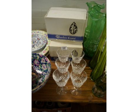 Three boxed sets of Waterford wine glasses. CONDITION REPORT: One sherry glass with minor chip to top rimOne medium glass wit