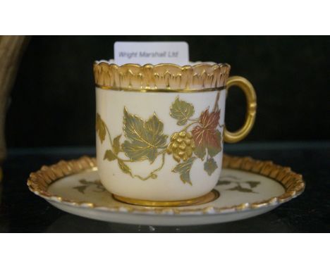 A Locke & Co Worcester blush ivory cup and saucer decorated with relief moulded floral decoration. CONDITION REPORT: Good con