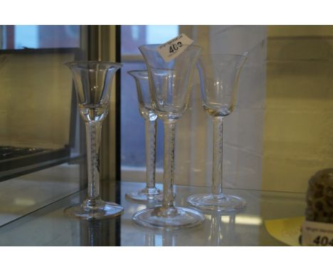 Four various 18th Century style airtwist wine glasses, each with bell shaped bowls.