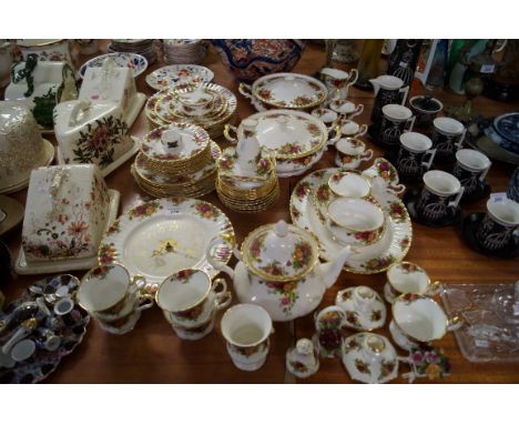 An extensive Royal Albert Old Country Roses tea and dinner service to include tureens, tea ware, wall clock etc. CONDITION RE