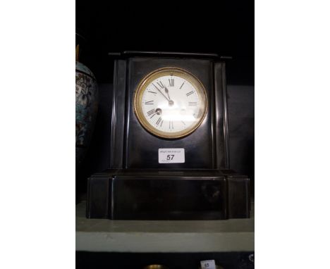 A Victorian slate mantel clock.
