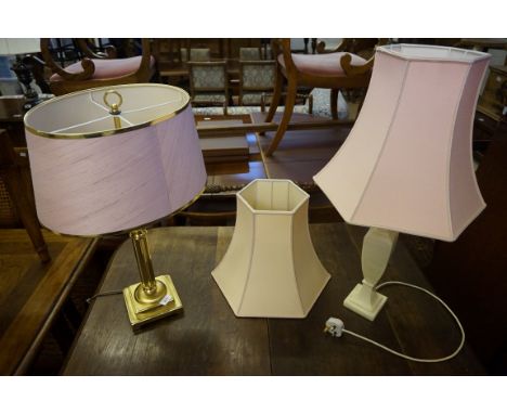 A gilt metal modern table lamp with Napoleonic style pink shade, an alabaster Italian table lamp complete with pink shade, so