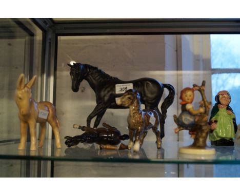 A mixed group of ceramic items to include Beswick black matt model of a horse, a Goebal Hummel figure, a Sylvac donkey etc. C