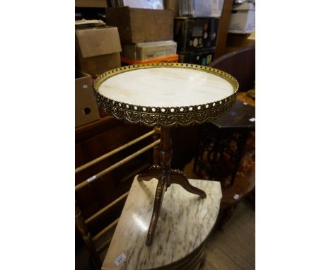 A French Louis XVIII style marbled topped coffee table, with gilt metal surround raised on turned wood base with three splaye