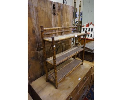 A bamboo three shelf unit.