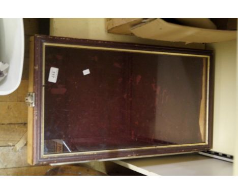 A vintage jewellery cabinet with glass top of rectangular form.