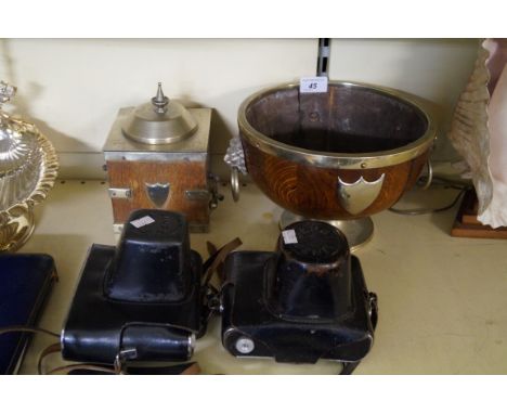An early 20th Century oak solid bowl with silver plated mounts, together with a similar tea caddy, together with two vintage 