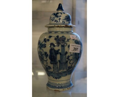 A late 18th Century Dutch ceramic baluster form jar and cover with floral decoration.