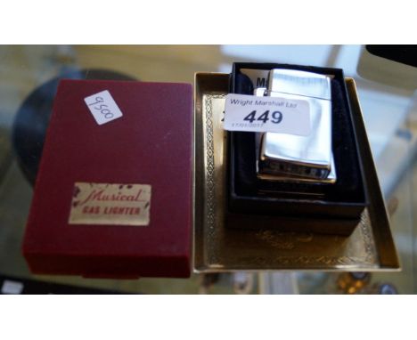 A mixed group of items to include Royal musical butane gas lighter in box, together with two further Zippo lighters and a rec
