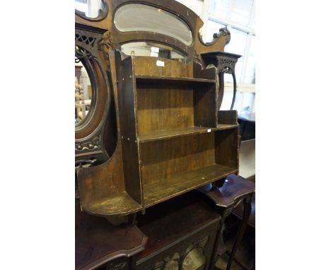 A 20th century oak hanging shelf unit 