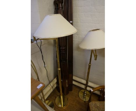 A pair of gilt metal adjustable standard lamp, complete with shades (sold electrically untested).
