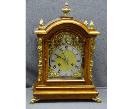 WALNUT CASED TWIN GONG-STRIKE BRACKET CLOCK, arched top with urn and flame finials, gilt metal mounts and pierced side panels