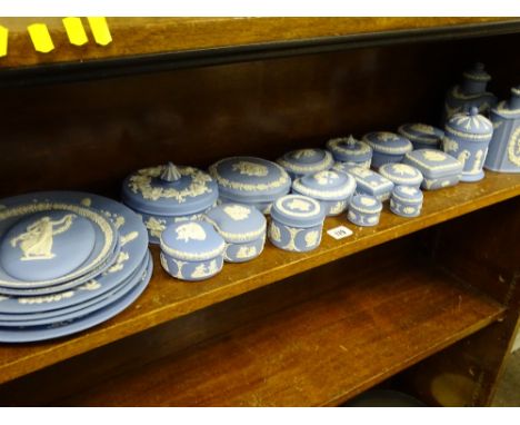 WEDGWOOD BLUE JASPERWARE, 25 pieces including a pair of lidded tea canisters, an oval plaque, various display plates and a mi