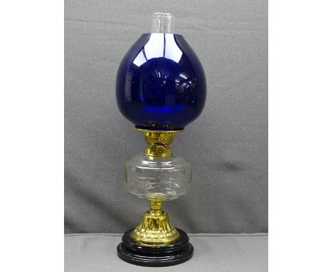 BRASS &amp; MIXED GLASS VICTORIAN OIL LAMP with black pot base, cut clear glass font and modern heavy gauge blue globular sha