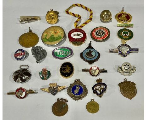 A collection of enamel badges, fobs, etc 