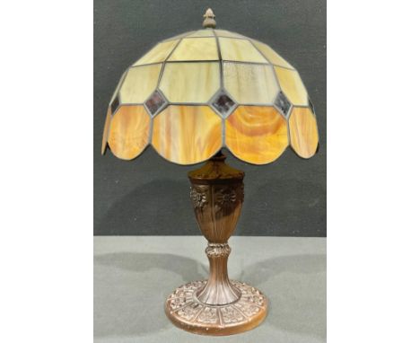 A contemporary Tiffany style leaded glass table lamp, the base moulded in the Art Nouveau manner with stylised flowers, 43cm 