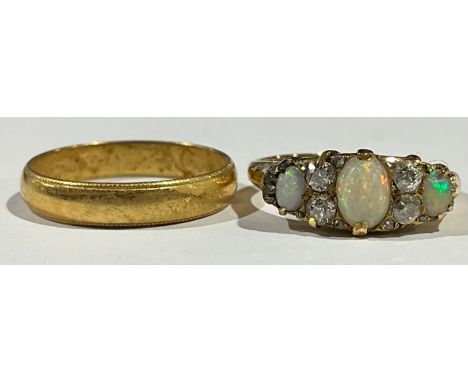 An 18ct gold opal and diamond ring, size K, 4.2g; an 18ct gold wedding band, size M/N, 2.8g (2) 