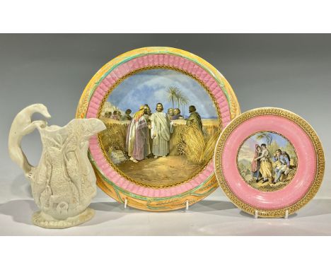 A 19th century Prattware bread plate, the field printed with 'Christ in the Cornfield', after H. Warren, the border moulded w