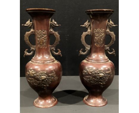 A pair of Japanese bronze vases, cast in relief with flowers and birds, dragon scroll handles, 40cm high, Meiji period 
