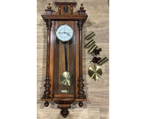 A mahogany Vienna wall clock, white enamel dial, Roman numerals, subsidiary seconds dial, twin winding holes, approx, 118cm h