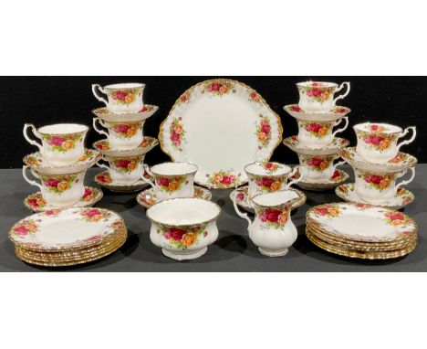 A Royal Albert Old Country Roses tea service for twelve, comprising cake plate, side plates, cream jug, sugar bowl, cups and 