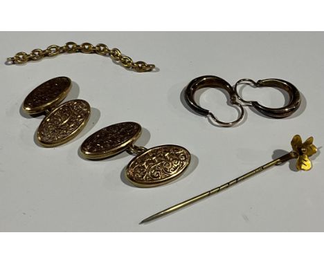 A pair of 9ct gold oval cufflinks; a pair of 9ct gold earrings; a yellow metal tie pin, as a shamrock, etc 