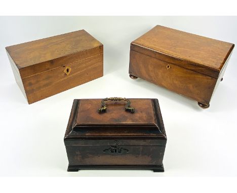 A Georgian mahogany tea caddy with a brass rococo carry handle, 24.5cms wide x 14.5cms deep x 14cms high; together with a 19t