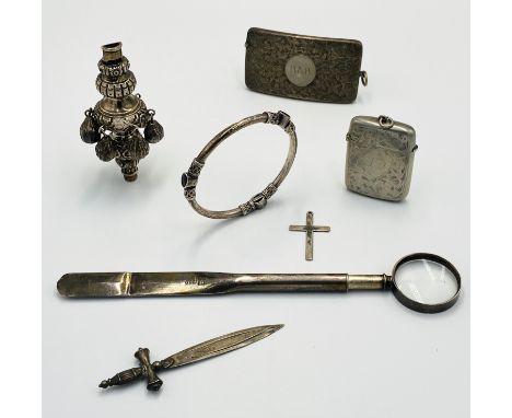 A Victorian silver card case, 45g; a silver rattle head, 49g; a white metal bangle, 18g; together with other items of silver.