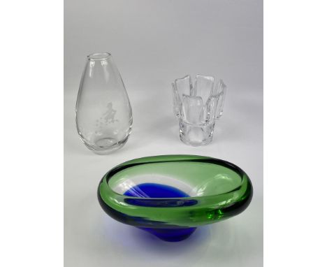 Three items of decorative glassware to include a heavy teardrop shaped vase with engraved decoration of a young girl collecti