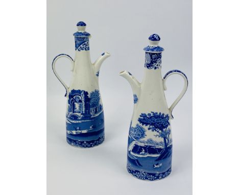 A contemporary pair of decorative blue and white Spode "Italian" pattern oil pots with covers. 10.5cms wide x 23cms high.Esti