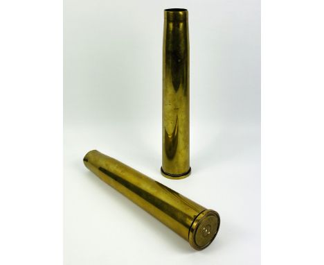 A pair of Brass artillery shells dated 1943, 31cms high x 6cms base diameter. Estimate £20-40.