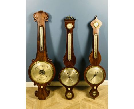 A 19th century mahogany wheel barometer with a bow fronted glass thermometer, 31cms wide x 102cms high; together with an earl