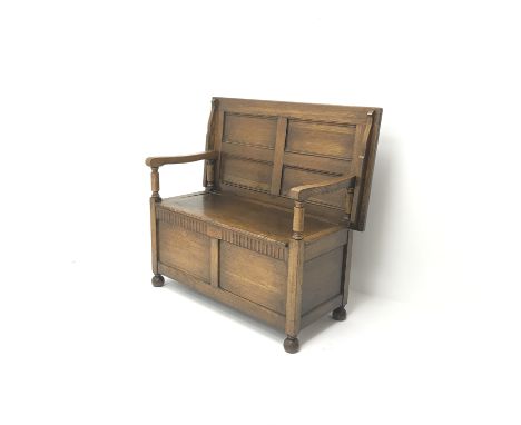 Early 20th century oak monks bench, hinged lid, turned supports, W107cm, H102cm, D56cm Condition Report Click here for furthe