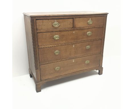 Georgian oak chest, reeded columns flanking two short and three long drawers, bracket supports, W126cm, H112cm, D55cm Conditi
