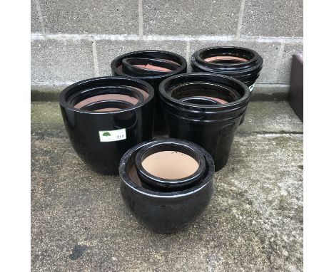 Fourteen glazed ceramic pots