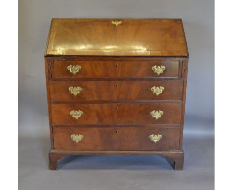 A George III Mahogany Bureau, the chequer line inlaid fall front enclosing a fitted interior above four long drawers with bra