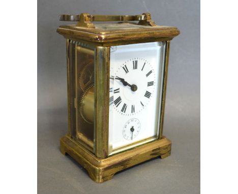 A French Brass Cased Carriage Clock, the enamel dial with Roman numerals and subsidiary alarms dial and with lever escapement
