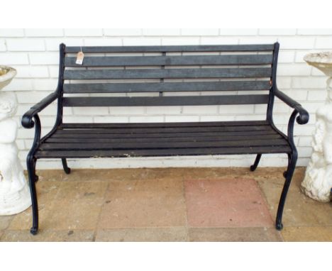 A metal ended garden bench (little bit rickety)