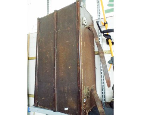 A large old trunk with wooden struts 