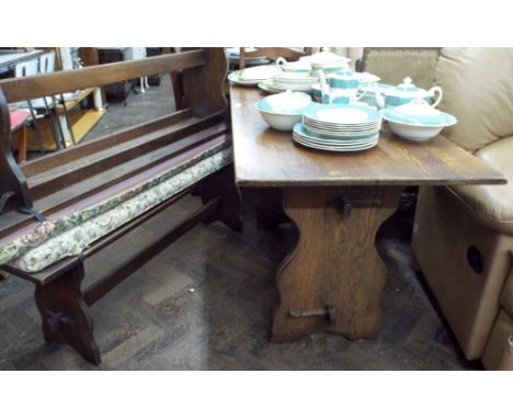 A reproduction oak refractory style dining table and a pair of matching bench seats with cushions, 4'6 long 