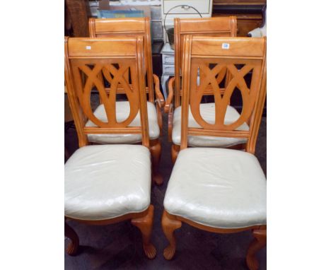 A set of four light cherry wood finished dining chair comprising of two carvers and two standards 