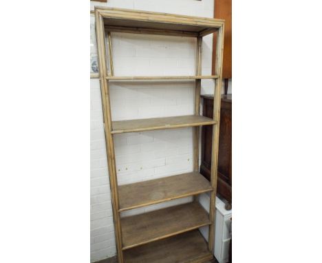 A light oak bamboo effect open bookcase matching the previous lot