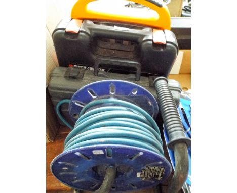 An extension lead, a Defender power light, Black & Decker drill and electric screwdriver 