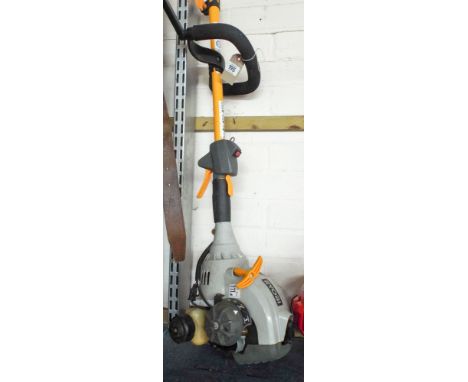 A Ryobi petrol engine strimmer 